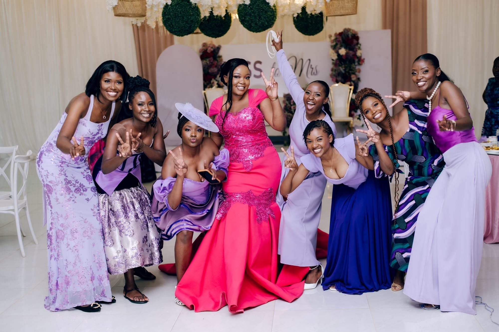 The bride and her party celebrating together in full colour