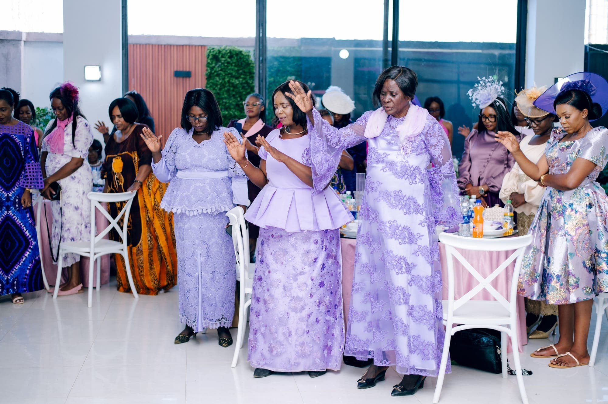 Guests in coordinated purple gathered at the celebration tables