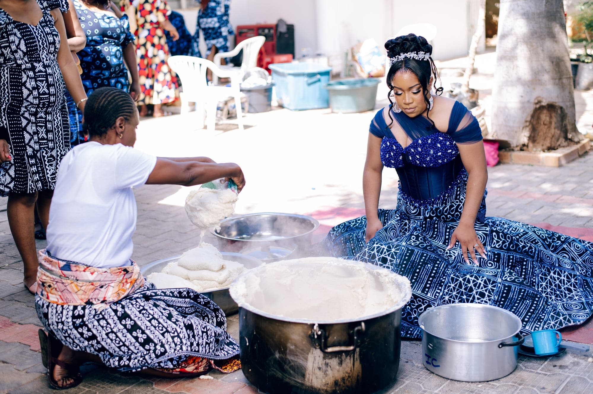 Traditional food prepared over open pots for the celebration