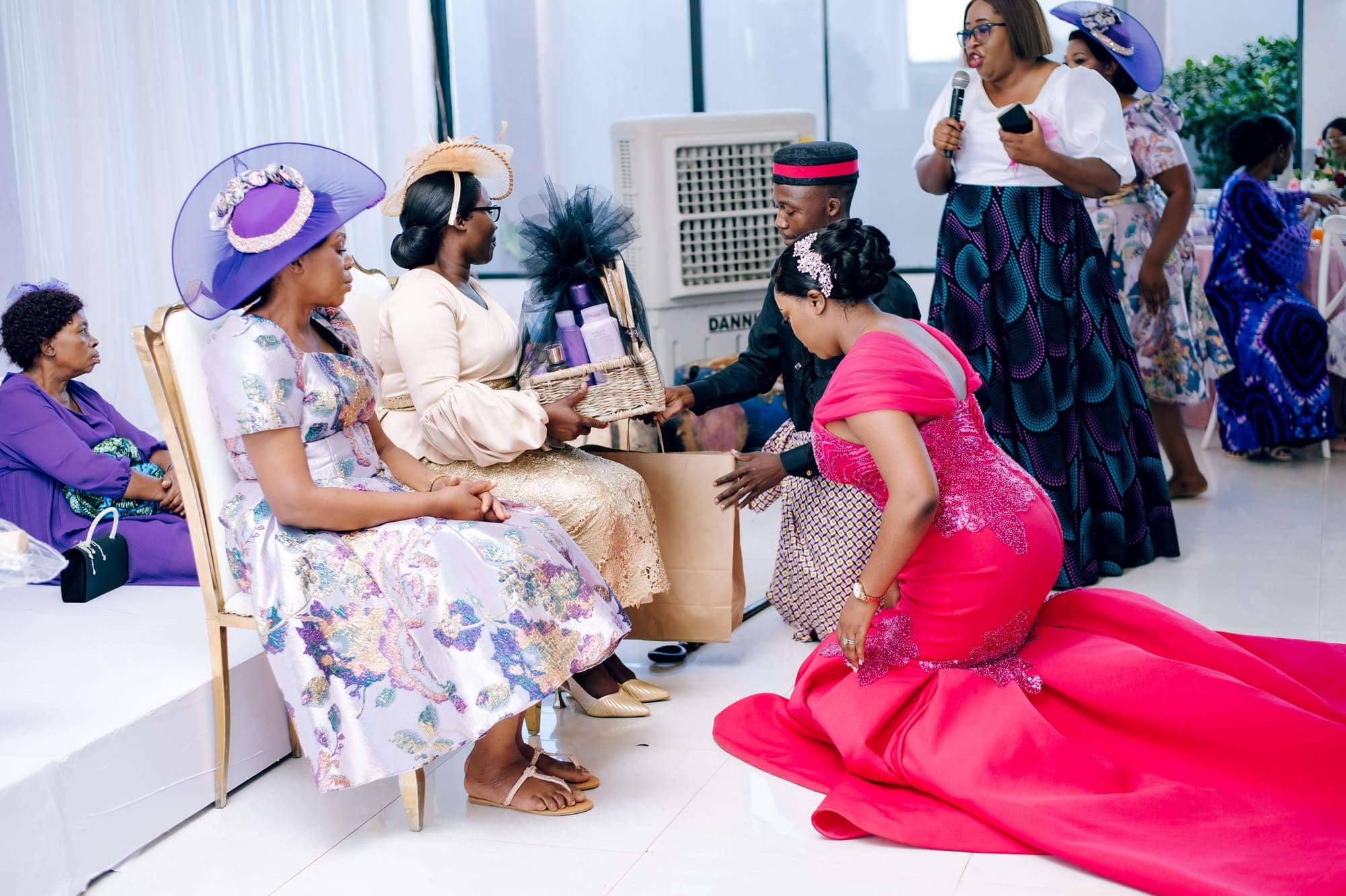 The bride greeting seated elders, a quiet moment in the rite